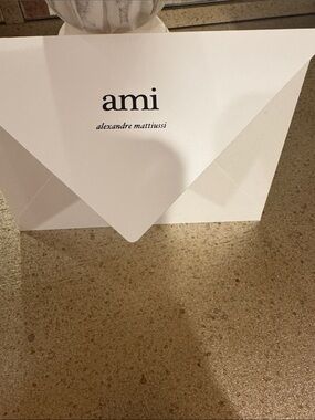 Ami White Envelope with Black Logo